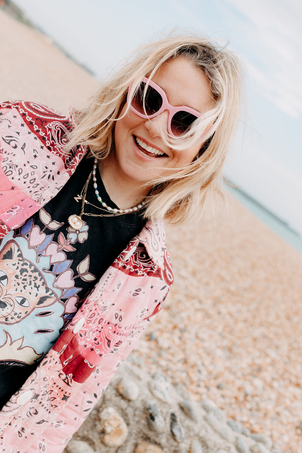Close-up of pink colourful sunglasses highlighting the vibrant frame details.