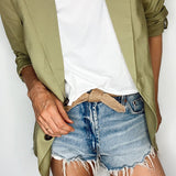 Handmade women's tie belt made from biodegradable materials, styled on a natural fabric background.
