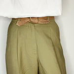 Close-up of tied biodegradable tie belt emphasizing handmade texture.