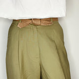 Close-up of tied biodegradable tie belt emphasizing handmade texture.