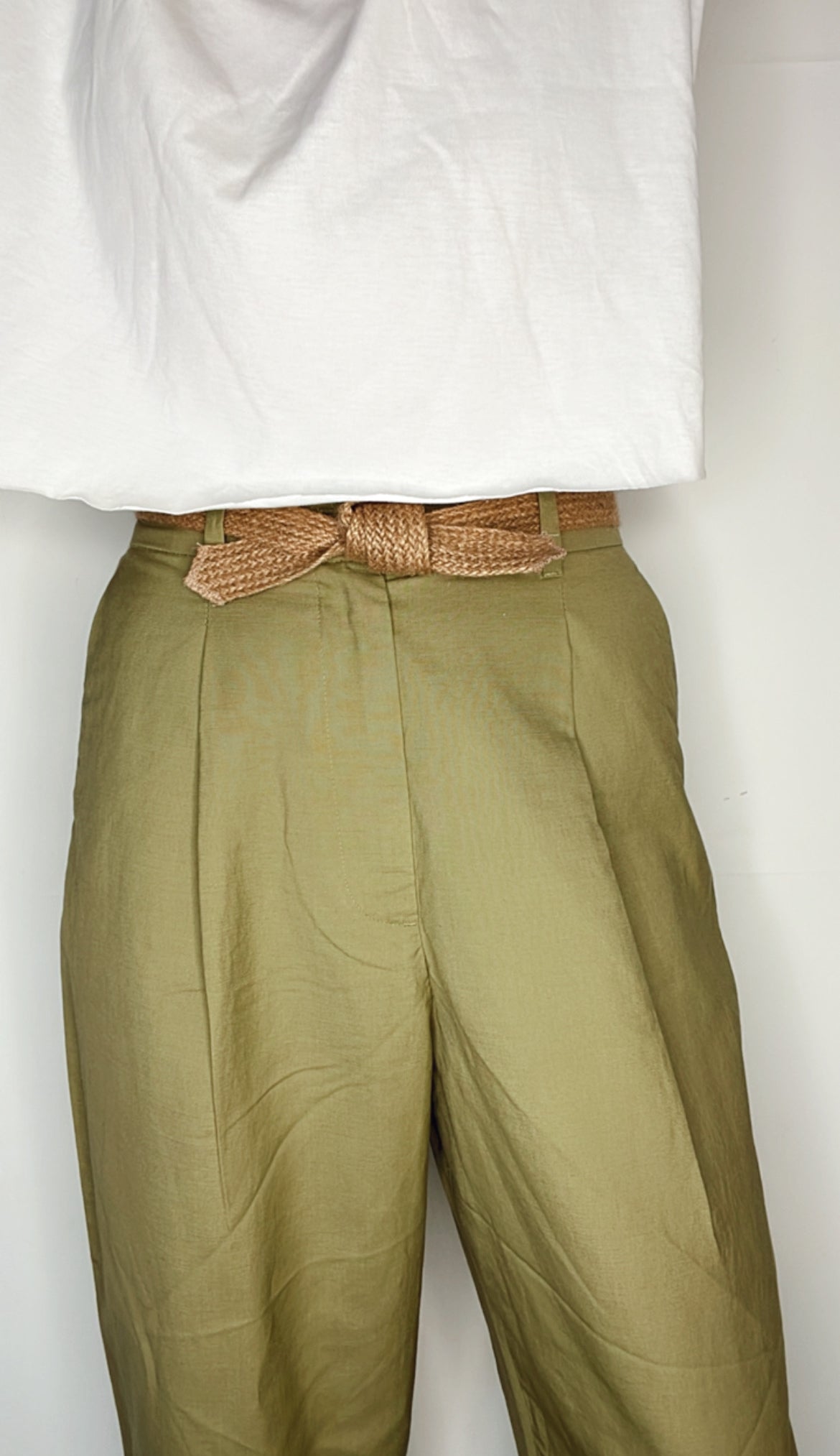 Close-up of tied biodegradable tie belt emphasizing handmade texture.