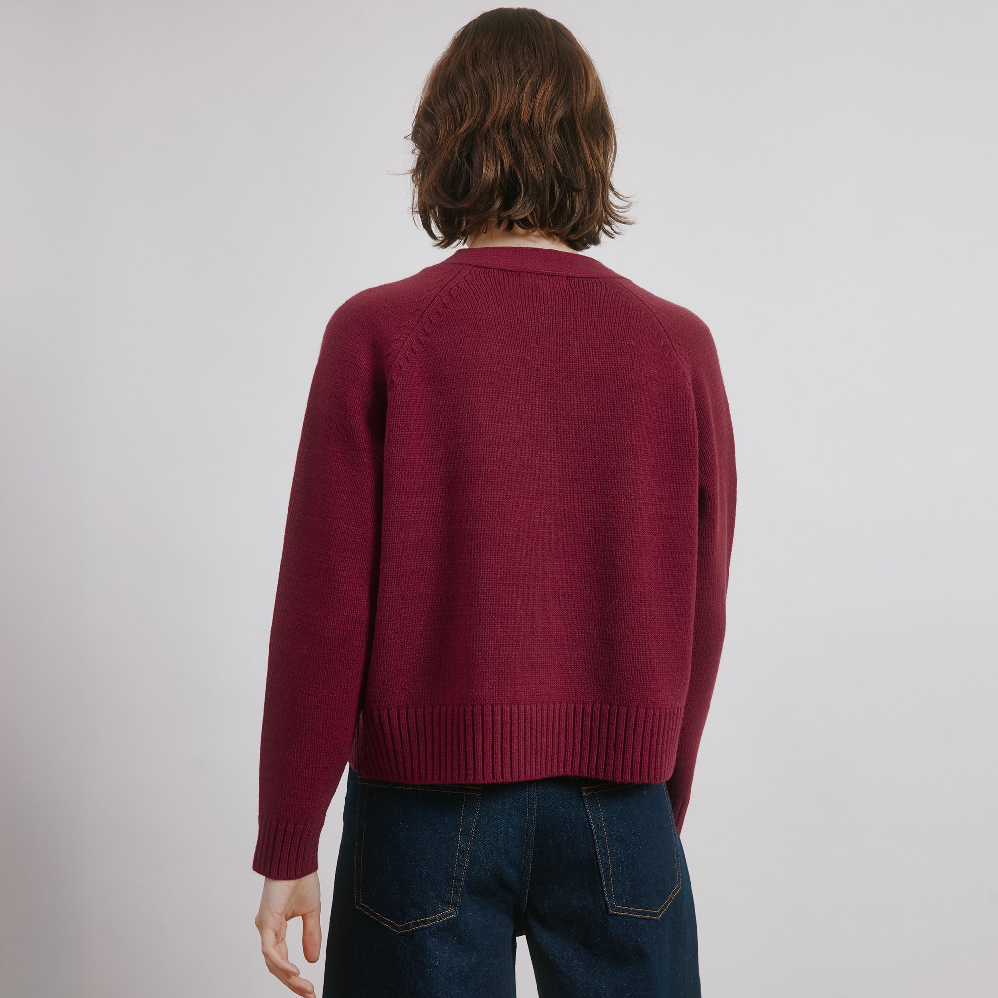 Relaxed fit red cardigan in wool blend knit with cosy v neck style