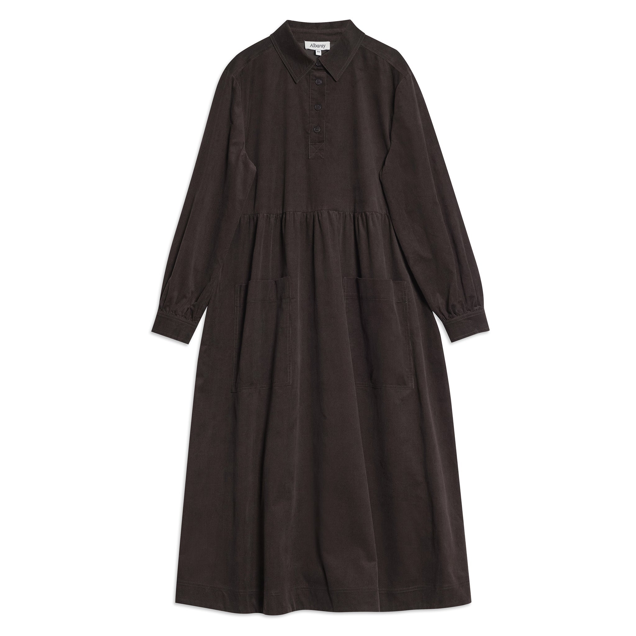 Close-up detail of sustainable corduroy dress with buttons and textured fabric in brown.