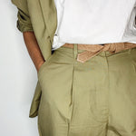 Detail shot of a handmade tie belt with biodegradable jute fibers.