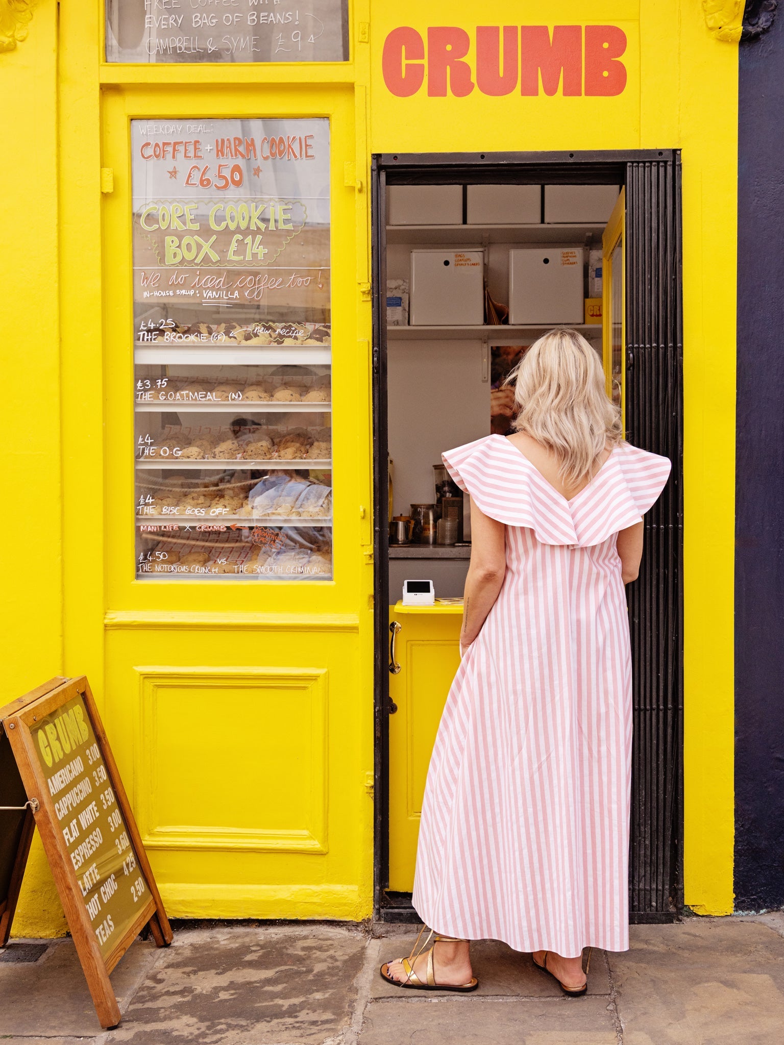 V-neck cotton summer dress featuring a ruffle neckline and A-line maxi silhouette.