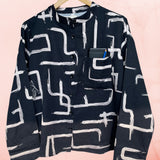 Black and White shirt on a hanger