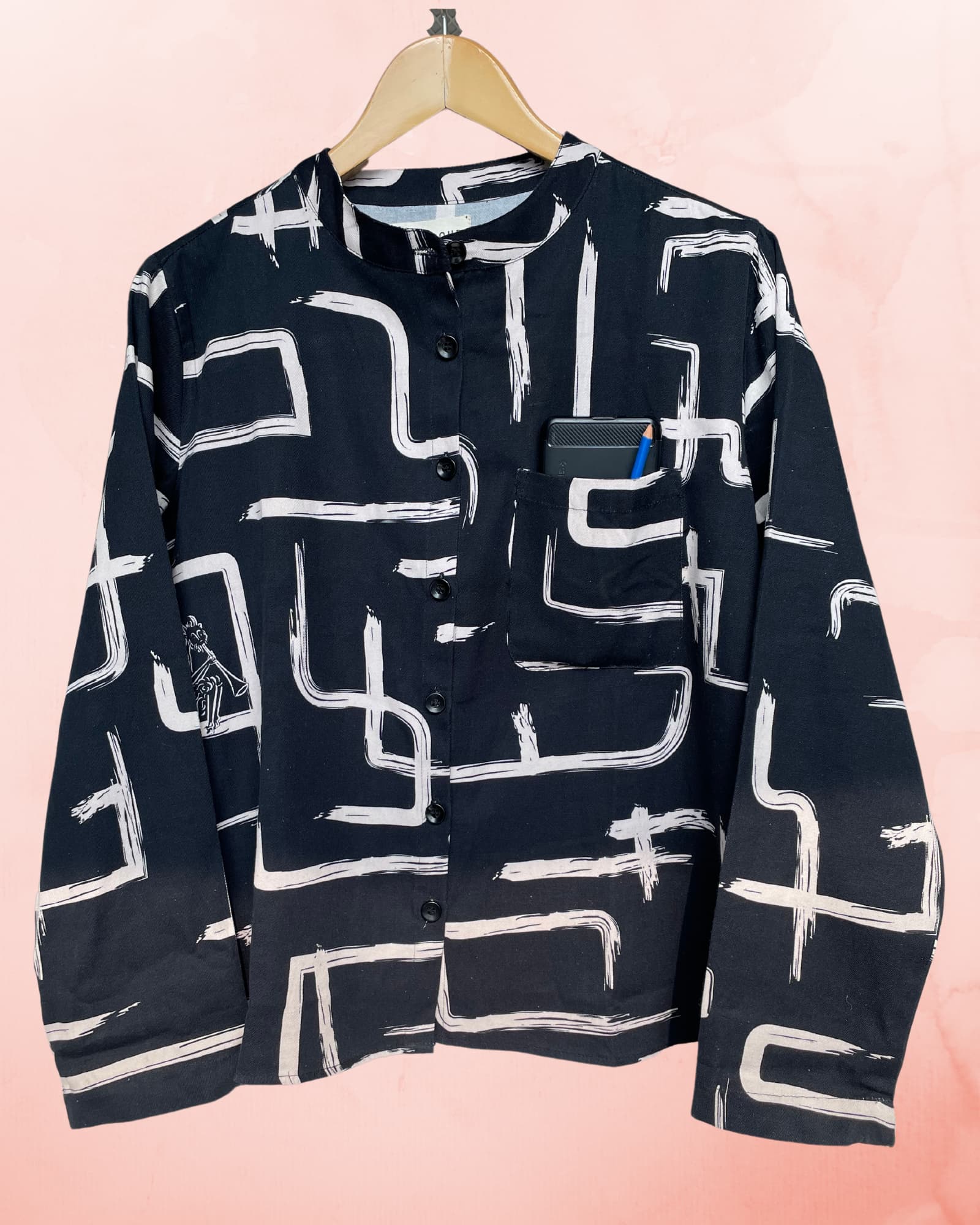 Black and White shirt on a hanger