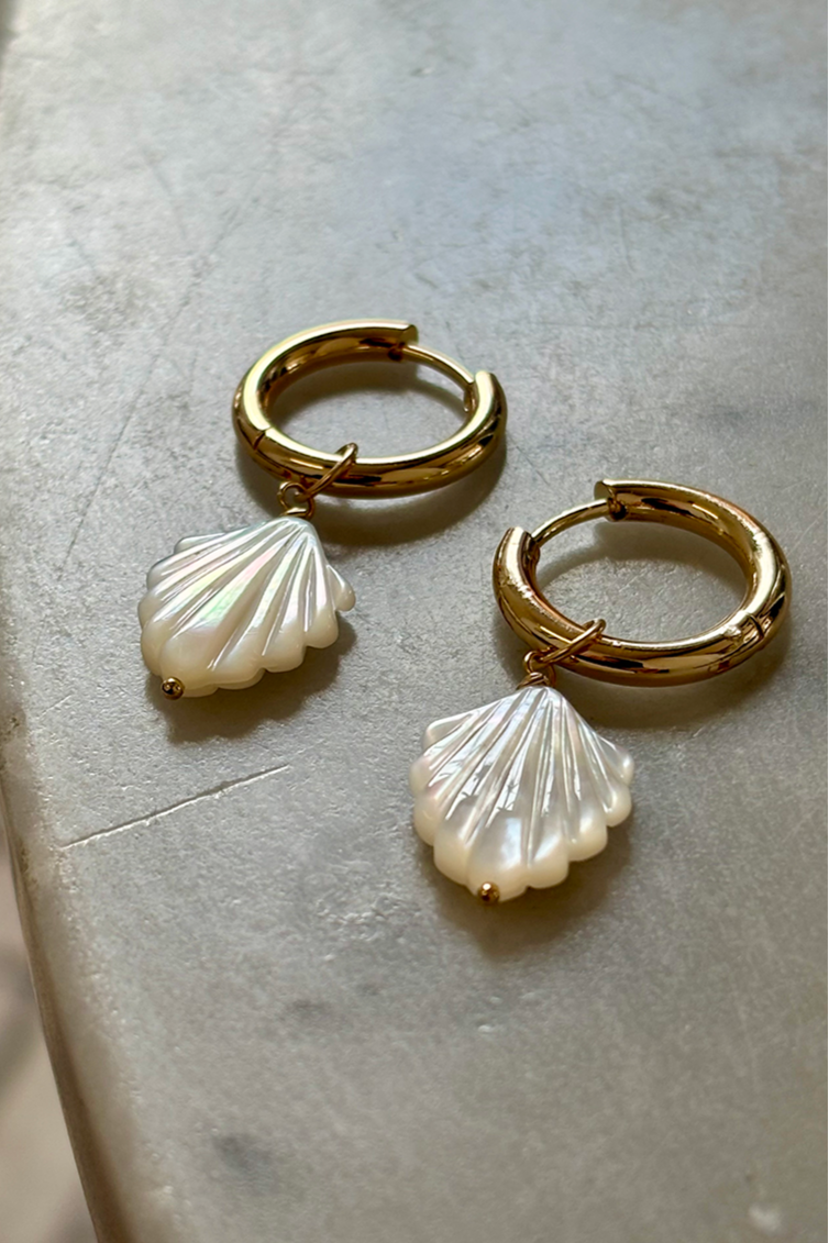 Gold plated hoop earrings with mother of pearl detailing, elegant and lightweight design.