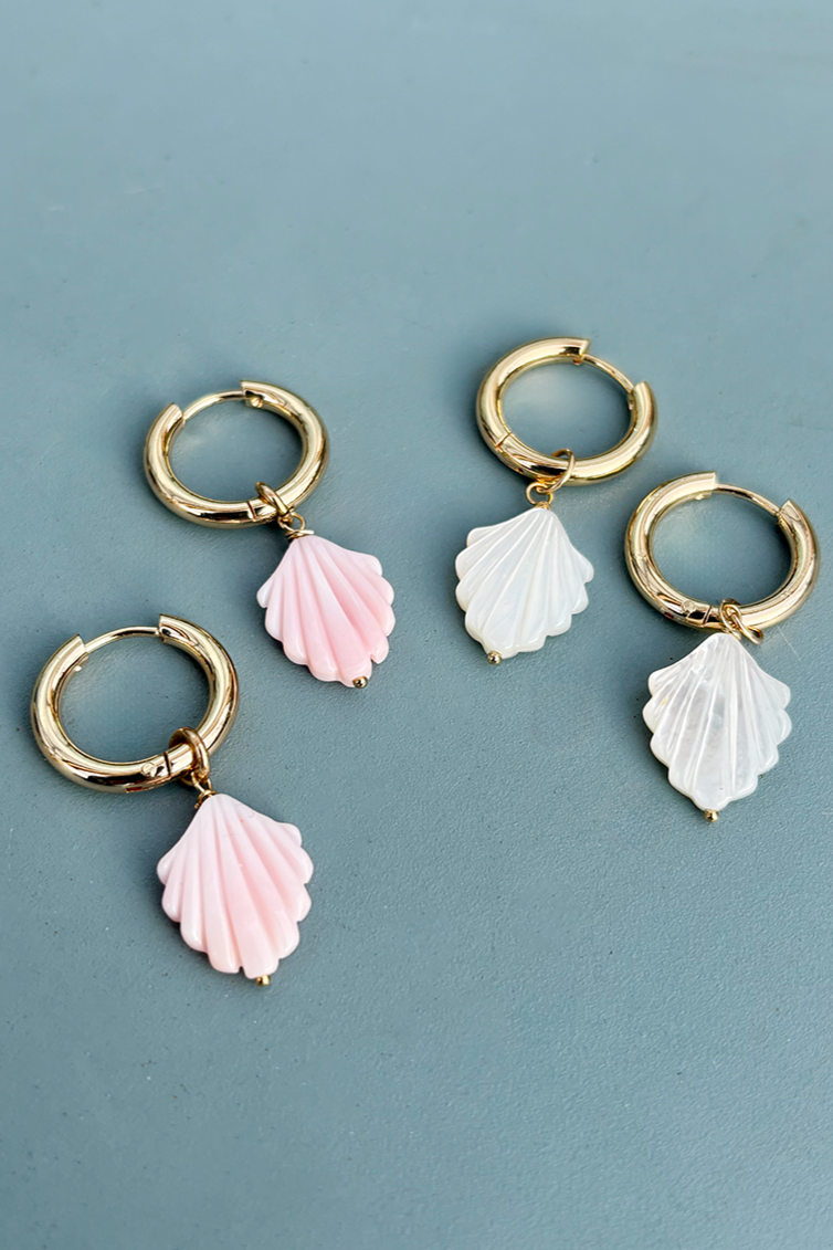 Stylish gold plated hoop earrings adorned with shimmering mother of pearl elements.