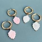 Stylish gold plated hoop earrings adorned with shimmering mother of pearl elements.