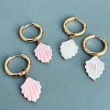 Stylish gold plated hoop earrings adorned with shimmering mother of pearl elements.