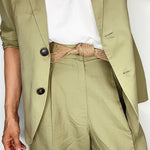 Handmade women's belt wrapped neatly, highlighting biodegradable craftsmanship.