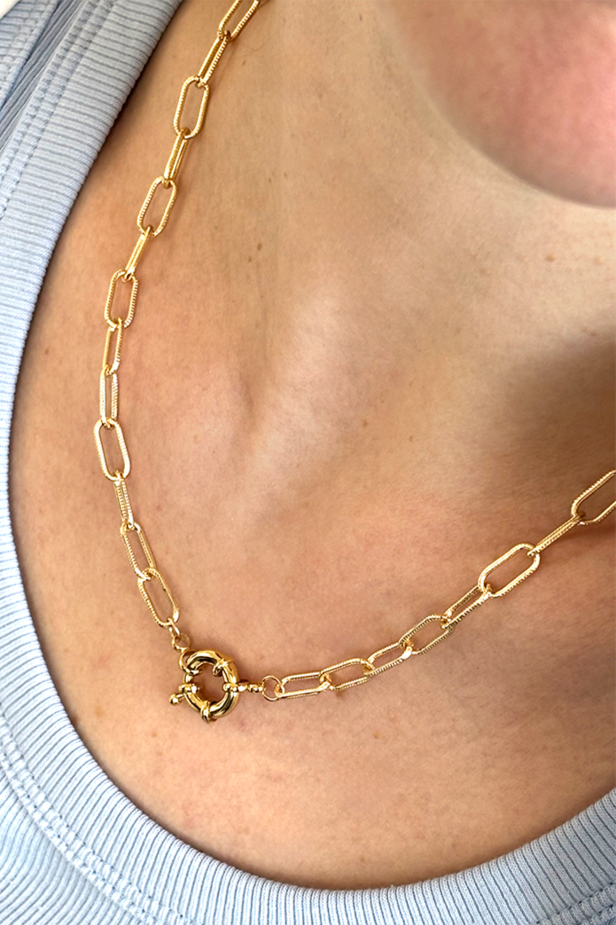 Gold plated delicate chain necklace featuring a bold chunky front clasp for statement style.