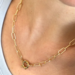 Gold plated delicate chain necklace featuring a bold chunky front clasp for statement style.