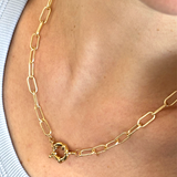 Gold plated delicate chain necklace featuring a bold chunky front clasp for statement style.