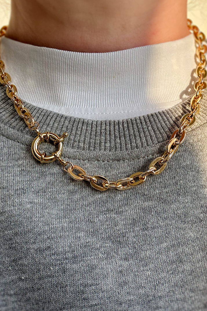 Gold plated chunky chain necklace with a bold front clasp detail.