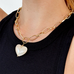 Mother of pearl pendant necklace with chunky gold plated chain for statement style.