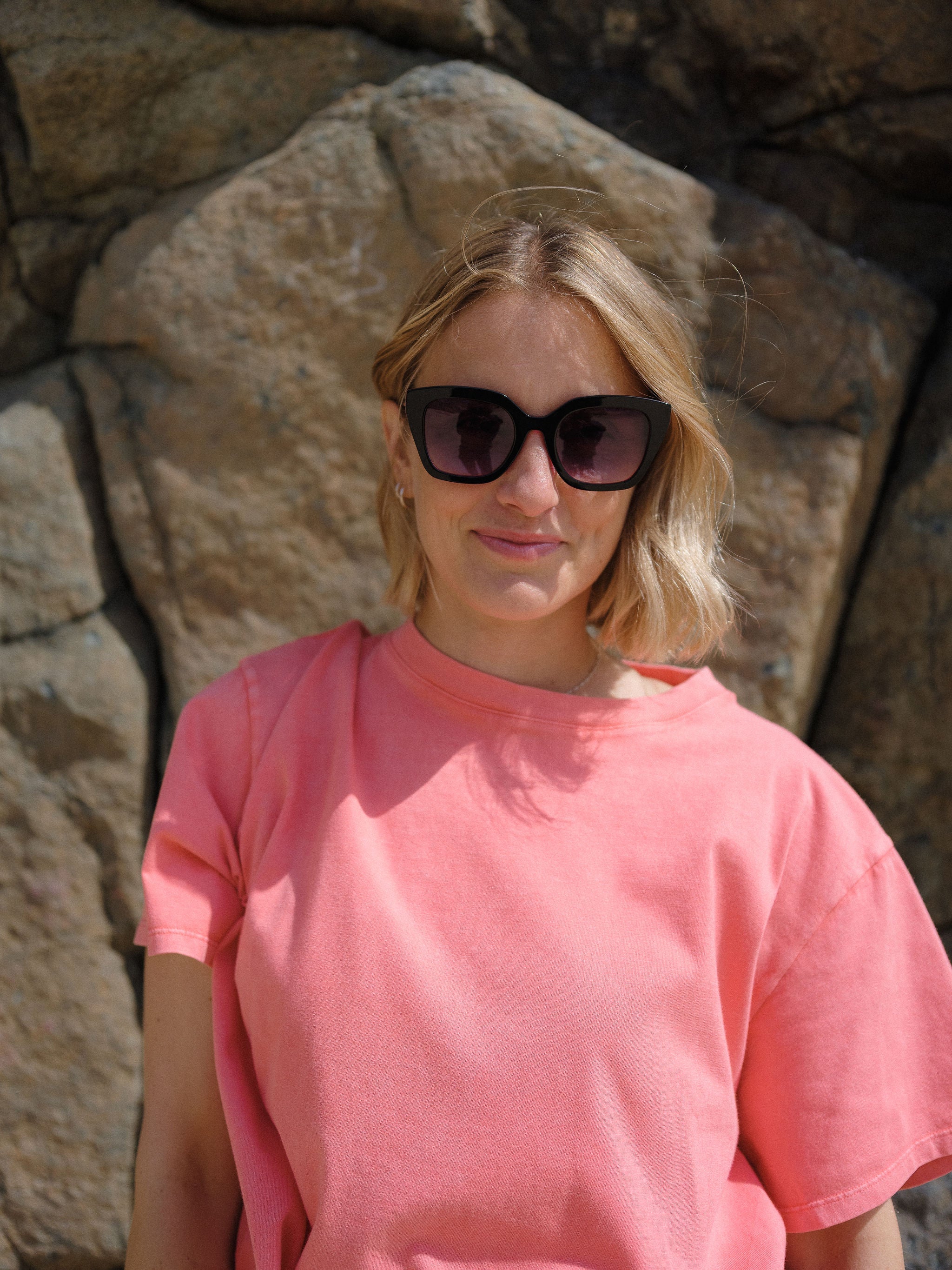 Colourful black sunglasses with coloured lenses and stylish design.