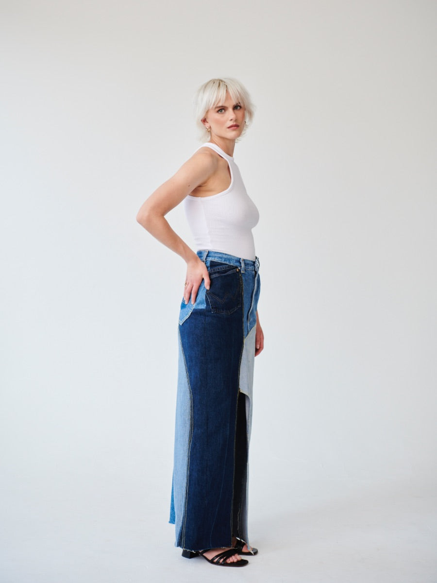 Embrace sustainability with our new upcycled denim maxi skirt. Crafted with love and a commitment to the environment, each skirt tells a unique story while reducing fashion waste.