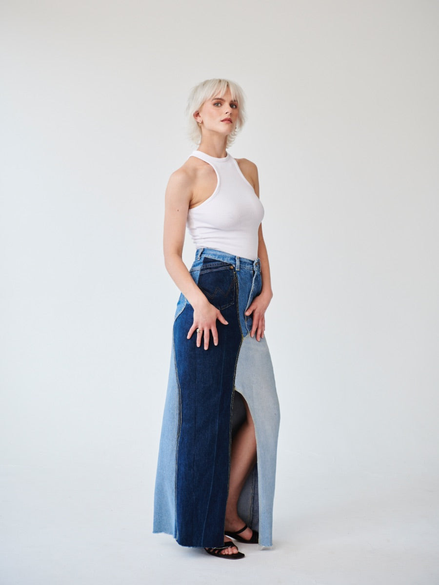 Embrace sustainability with our new upcycled denim maxi skirt. Crafted with love and a commitment to the environment, each skirt tells a unique story while reducing fashion waste.