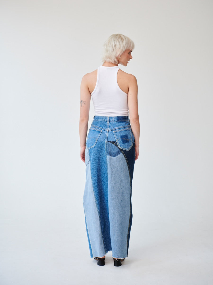 Embrace sustainability with our new upcycled denim maxi skirt. Crafted with love and a commitment to the environment, each skirt tells a unique story while reducing fashion waste.