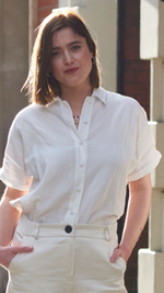 A contemporary take on the classic linen shirt. The short-sleeved shirt design features a relaxed and comfortable fit, with a cross pleat back and flattering dropped hem. Featuring a split side seam, traditional collar, and luxurious covered buttons. This bestselling shirt is a staple for a sustainable, long-lasting wardrobe.