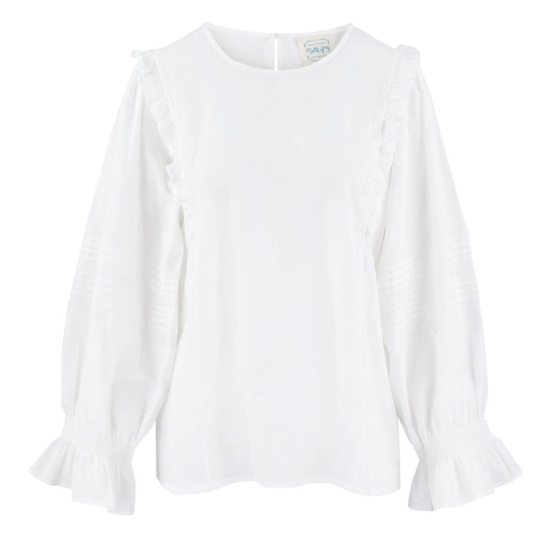  The prettiest simple white blouse this easy to wear top is made from 100% organic cotton.  The Amelie ruffle top by Dilli Grey has a relaxed fit, with delicate embroidery and statement ruffles down the sides of the blouse and around the elasticated cuffs. An absolute spring staple to wear dressed down with jeans or under dungarees, or dress it up with a skirt or pinafore dress.