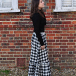 woman wearing gingham skirt side