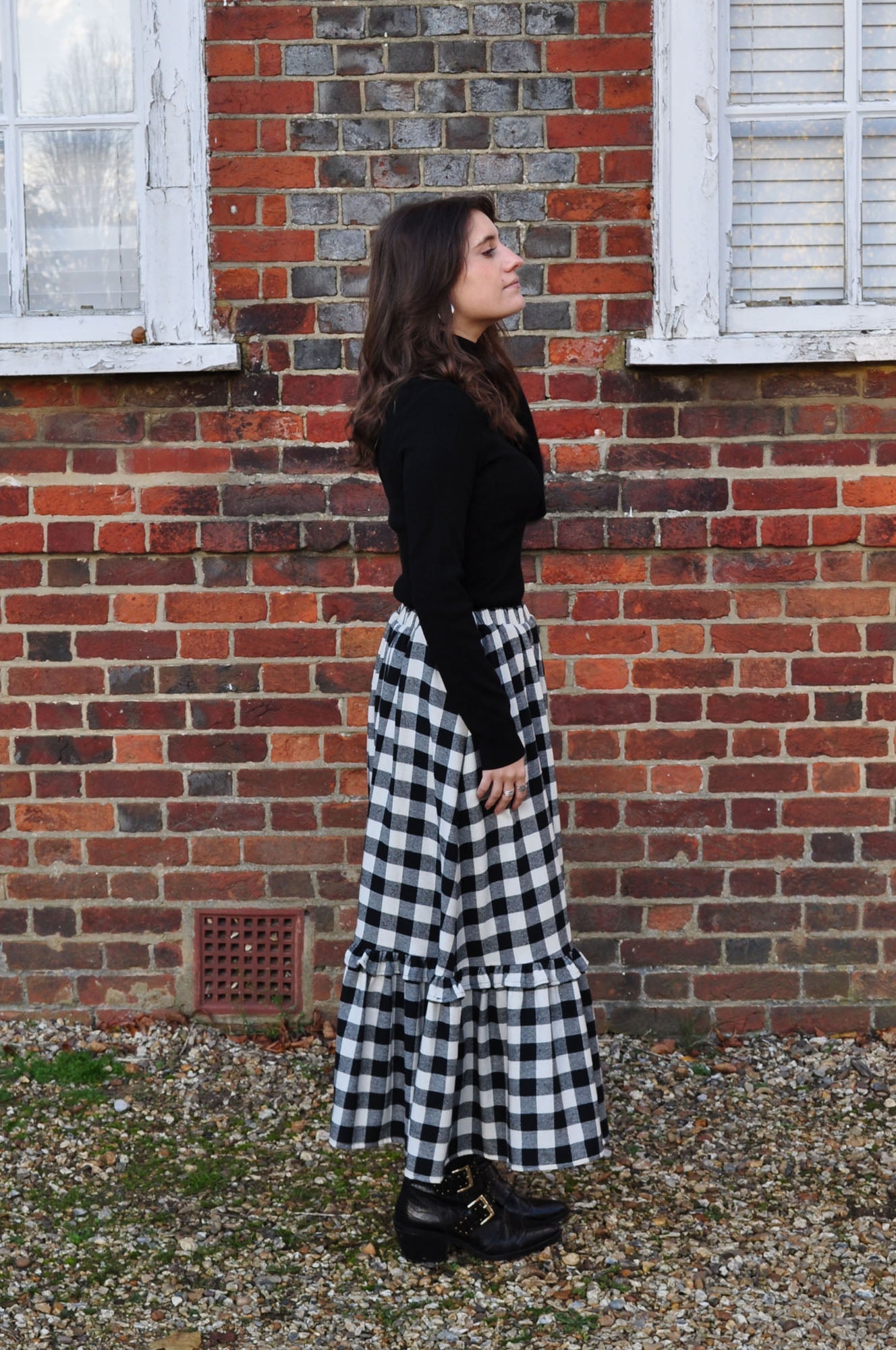 woman wearing gingham skirt side