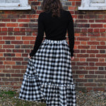 woman wearing gingham skirt with ruffle