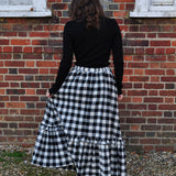 woman wearing gingham skirt with ruffle