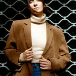 Tan blazer worn open for a relaxed look, relaxed wool blazer with roomy shoulders and a boxy silhouette, tailored wool jacket ideal as an autumn wool blazer
