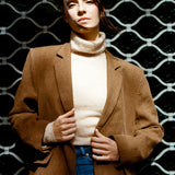 Tan blazer worn open for a relaxed look, relaxed wool blazer with roomy shoulders and a boxy silhouette, tailored wool jacket ideal as an autumn wool blazer