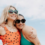 Tortoiseshell sunglasses with wide arms and glossy finish.