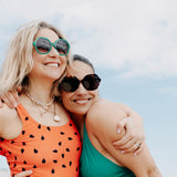 Tortoiseshell sunglasses with wide arms and glossy finish.
