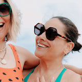 Close-up of tortoise shell sunglasses highlighting the detailed frame design.