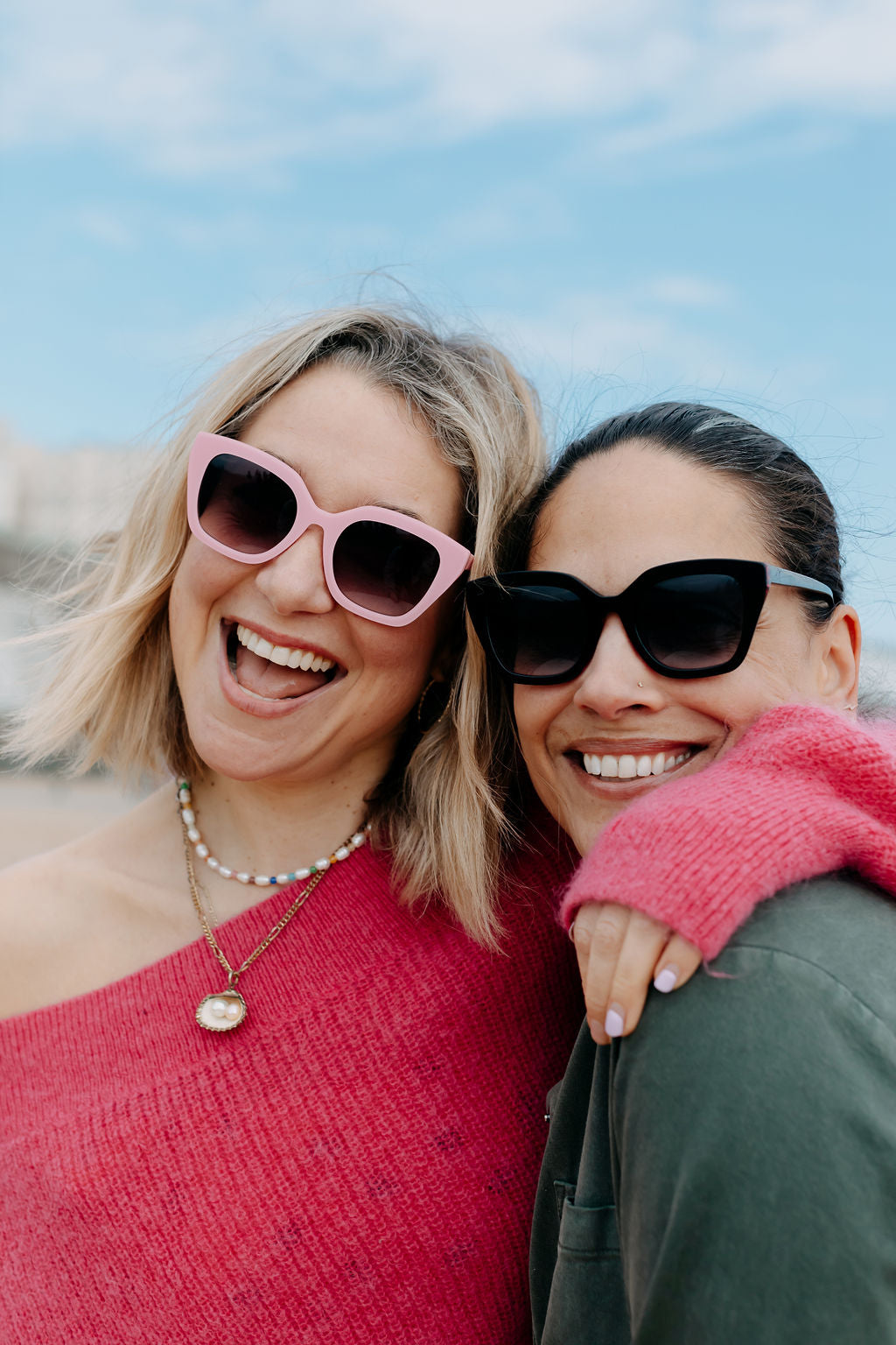 Packaged colourful pink sunglasses ready for retail display.