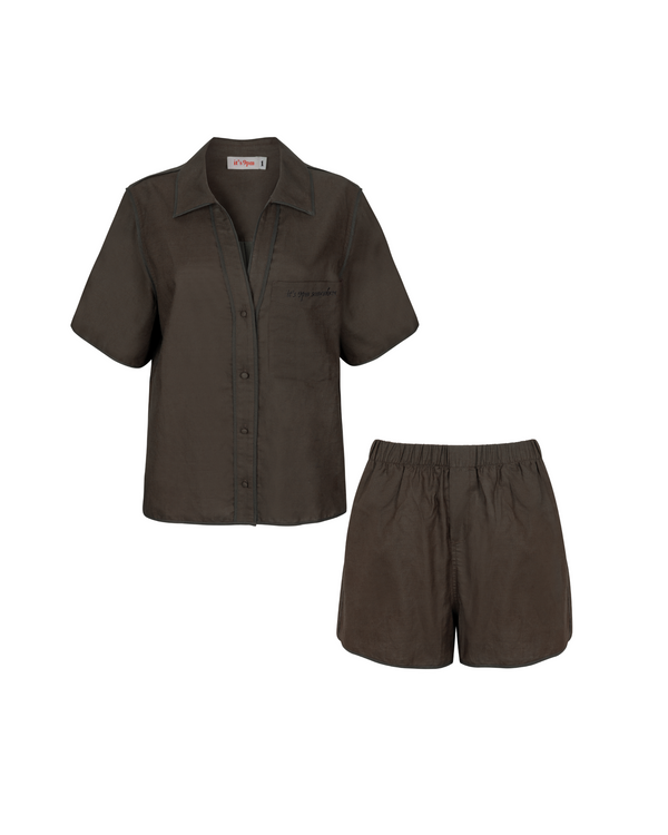 Relaxed fit linen two piece set with short sleeve button down shirt and high waisted shorts.