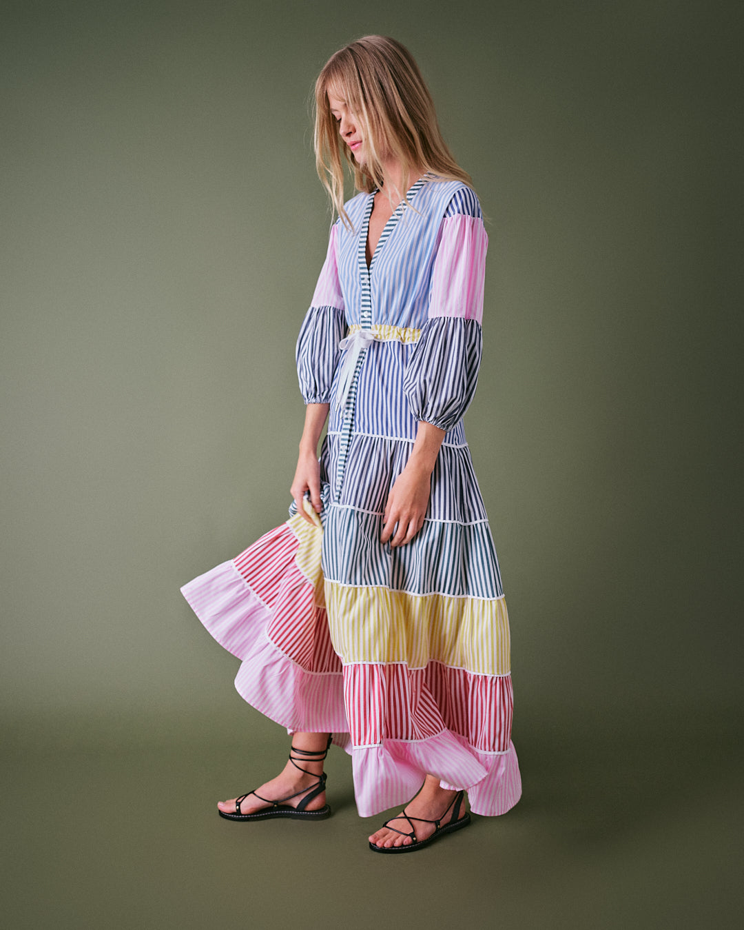 Stripe maxi dress with multicolour stripes, tiered skirt, balloon sleeves, and cinched waistline.