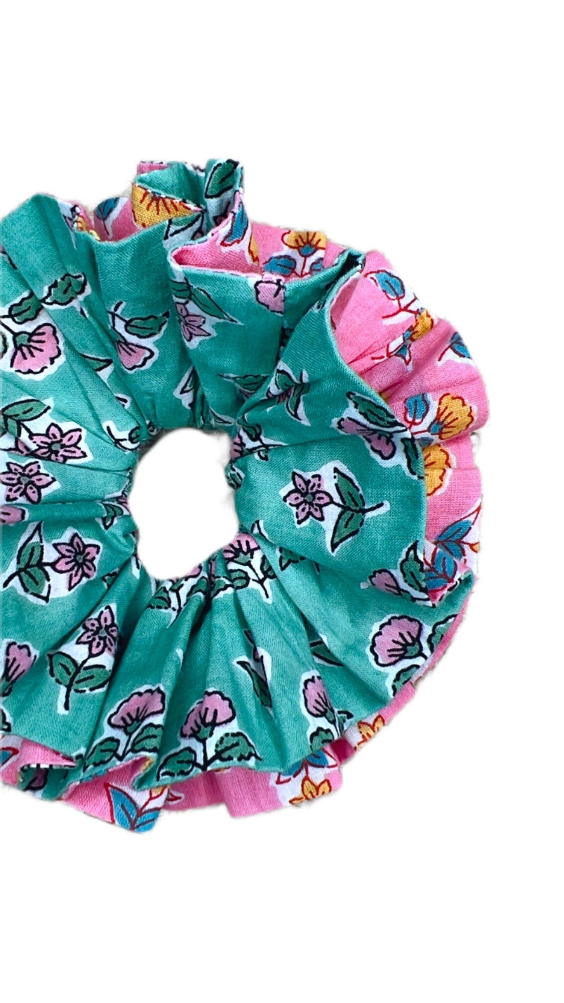 Oversized green floral scrunchie with large fabric folds for a statement look.
