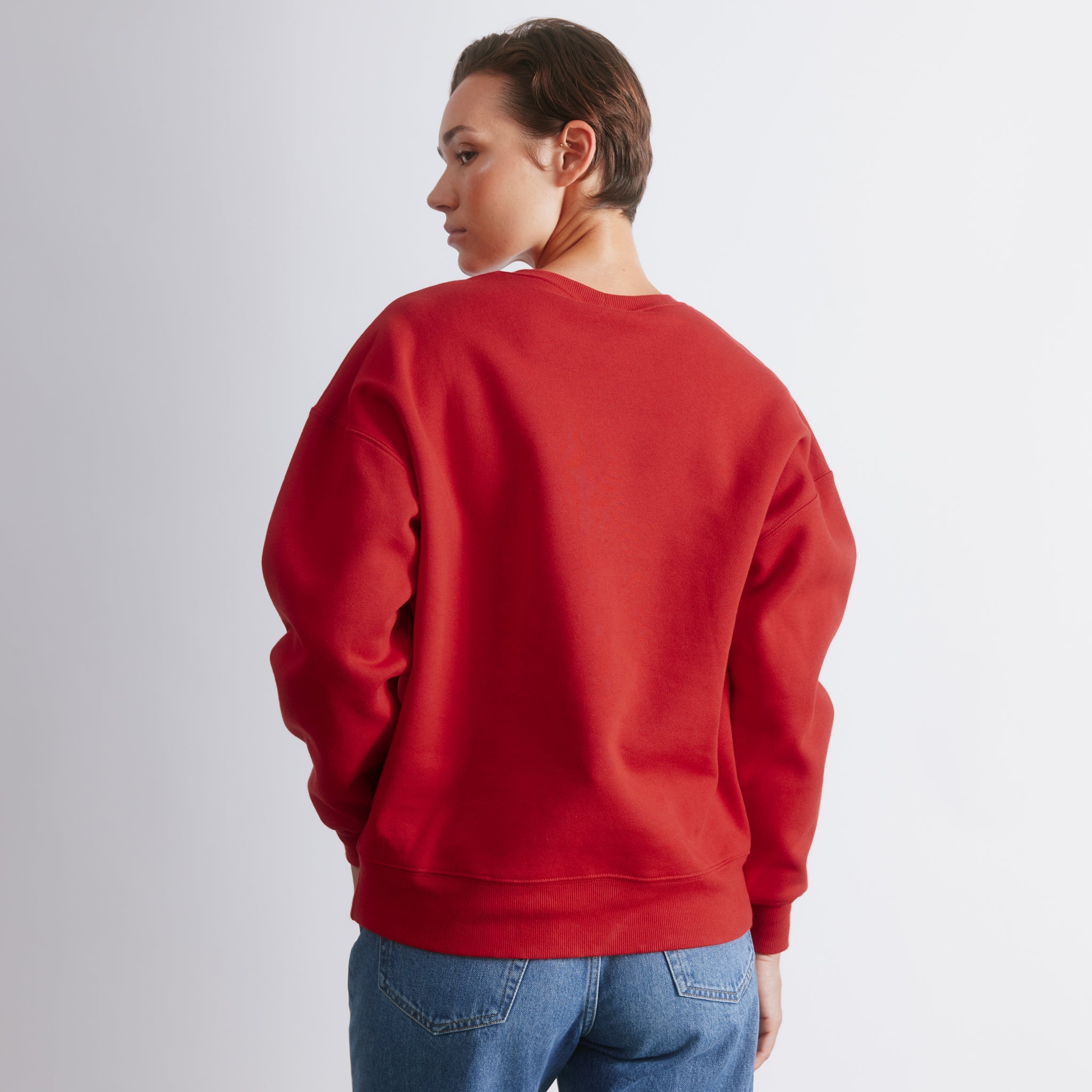 Red embroidered sweatshirt with relaxed fit and cherry motif, casual cotton blend oversized pullover, embroidered logo crewneck with fun slogan, fleece lined winter layering jumper, versatile everyday sweater.