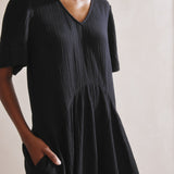 Lightweight cotton summer dress in a long A-line design, perfect for warm weather.
