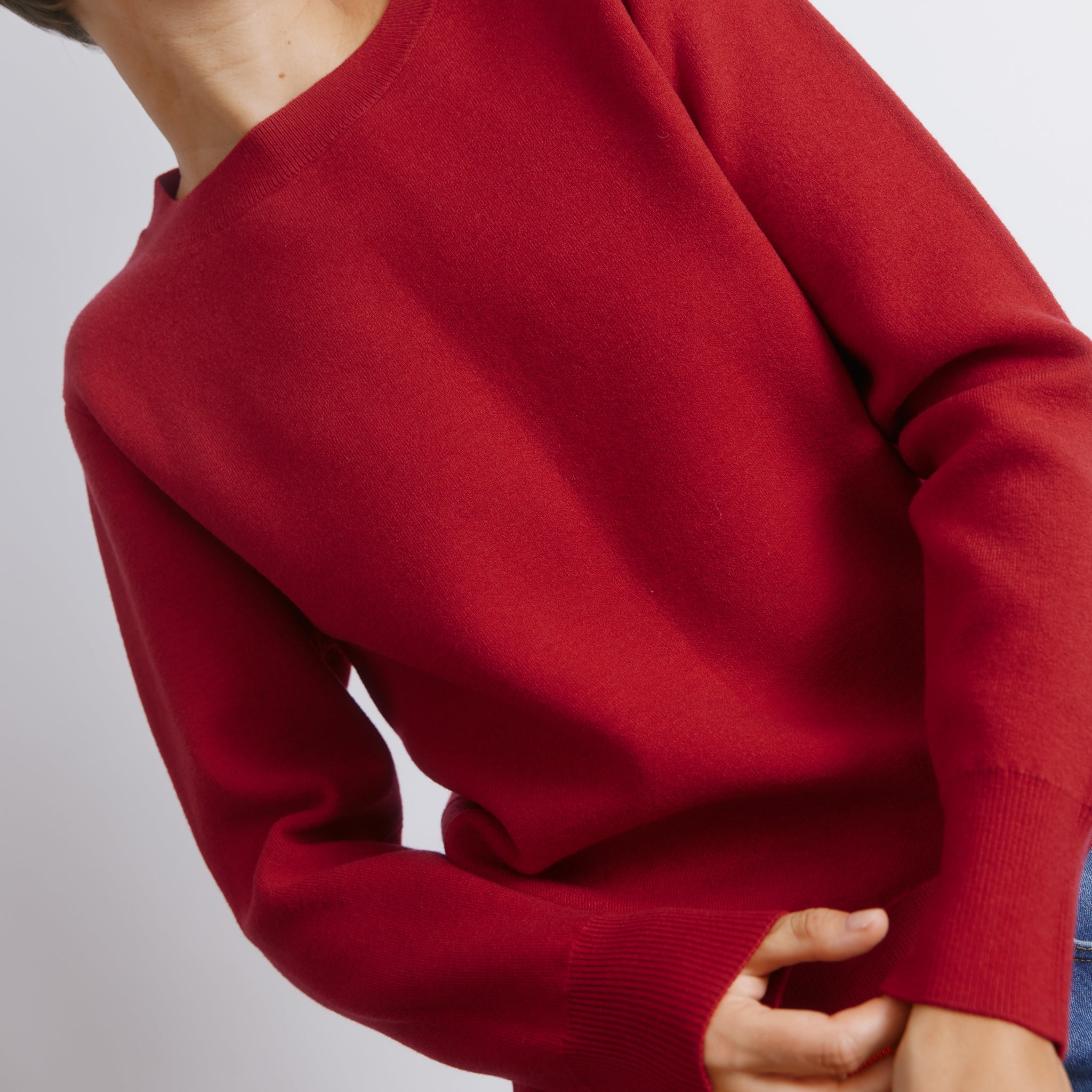 Bright red jumper with casual fit wool blend knit, vibrant red pullover ideal for cosy layering, ethically made sustainable knitwear, warm wool blend fabric