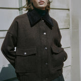 Brown flannel jacket with removable collar styled as versatile outerwear  