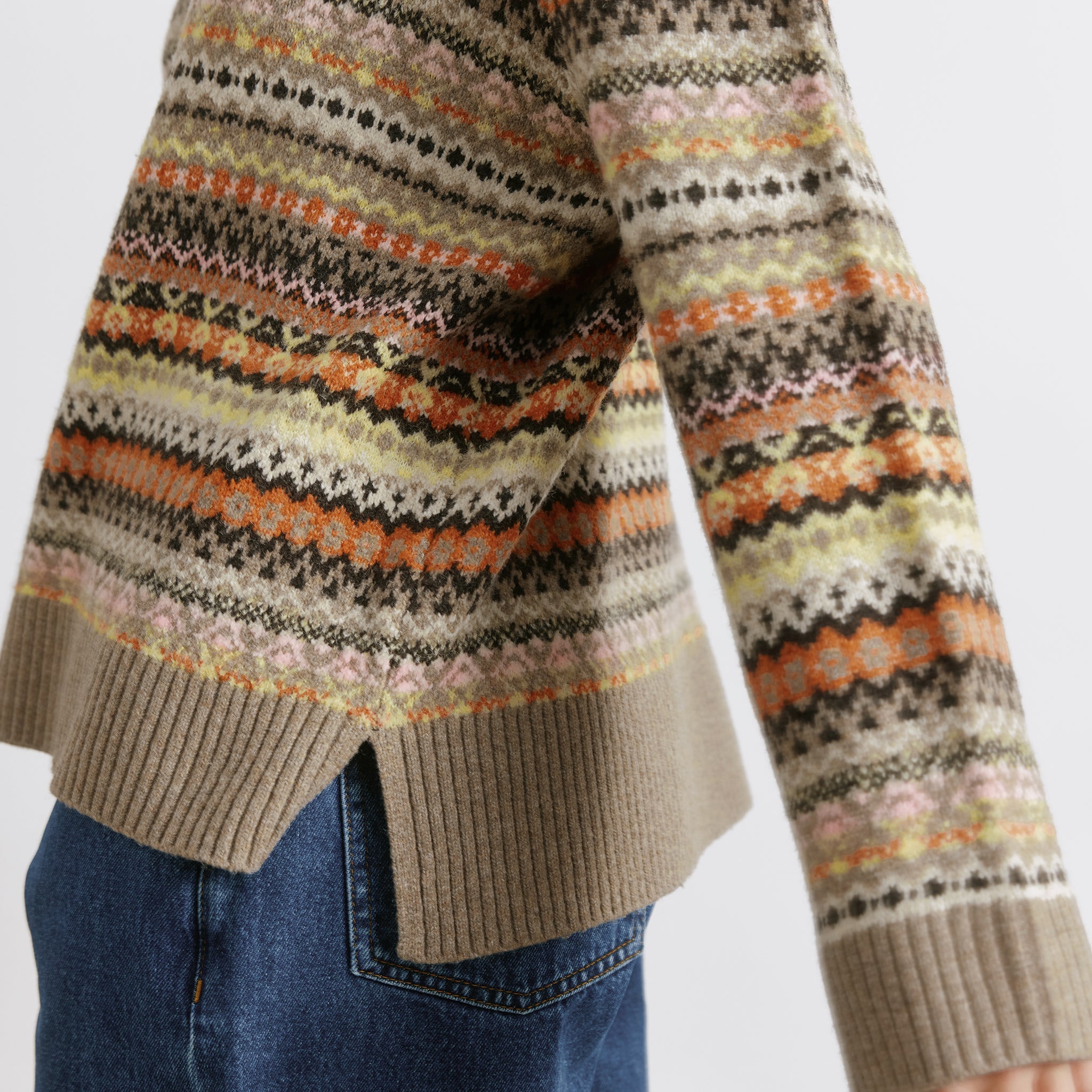 Traditional fair isle sweater styled as a soft neutral wool blend piece  