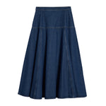 Model wearing indigo denim midi skirt with drop waist and A-line shape, perfect for a conscious wardrobe staple made from sustainable materials.