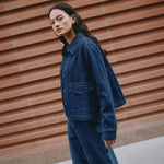Indigo denim jacket back view, A-line silhouette, contrast stitching, ethically made denim jacket