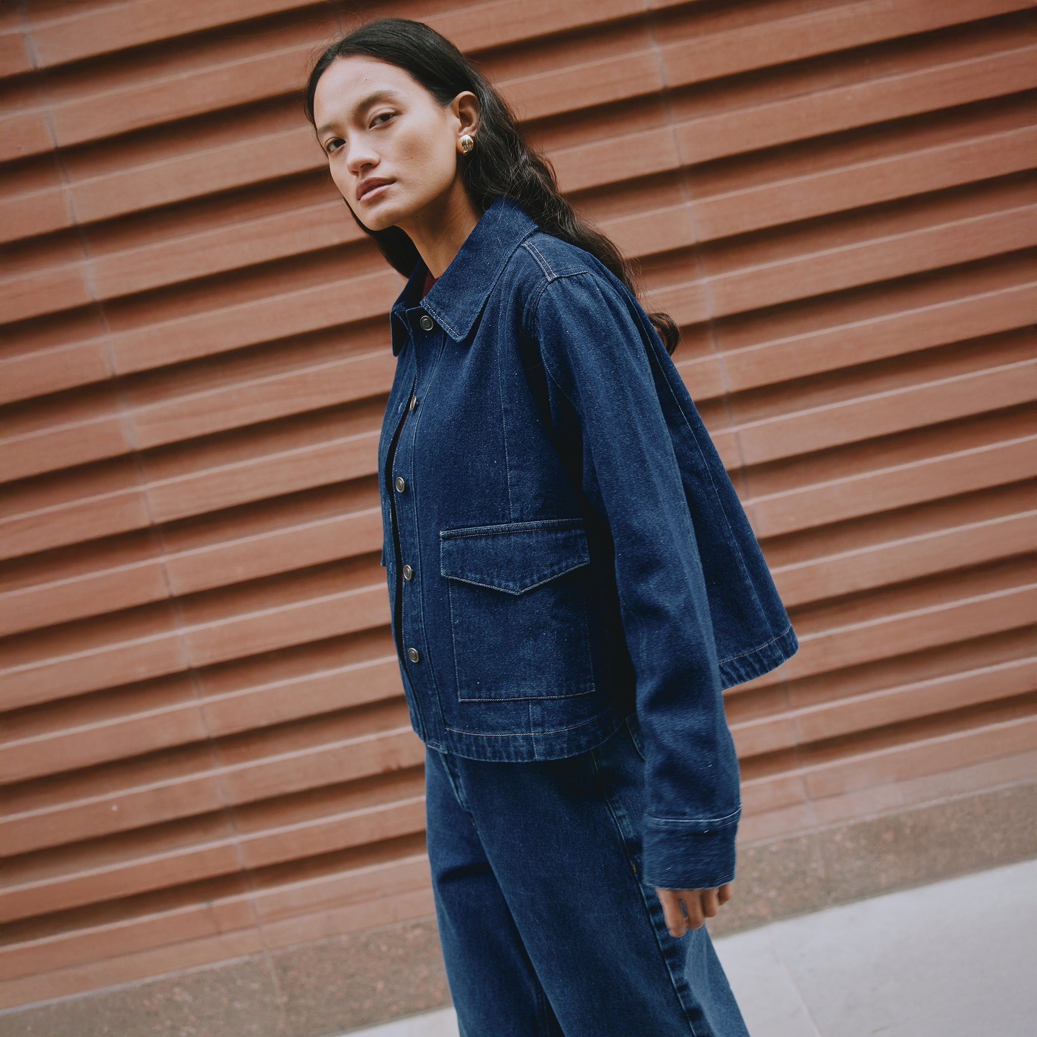 Indigo denim jacket back view, A-line silhouette, contrast stitching, ethically made denim jacket