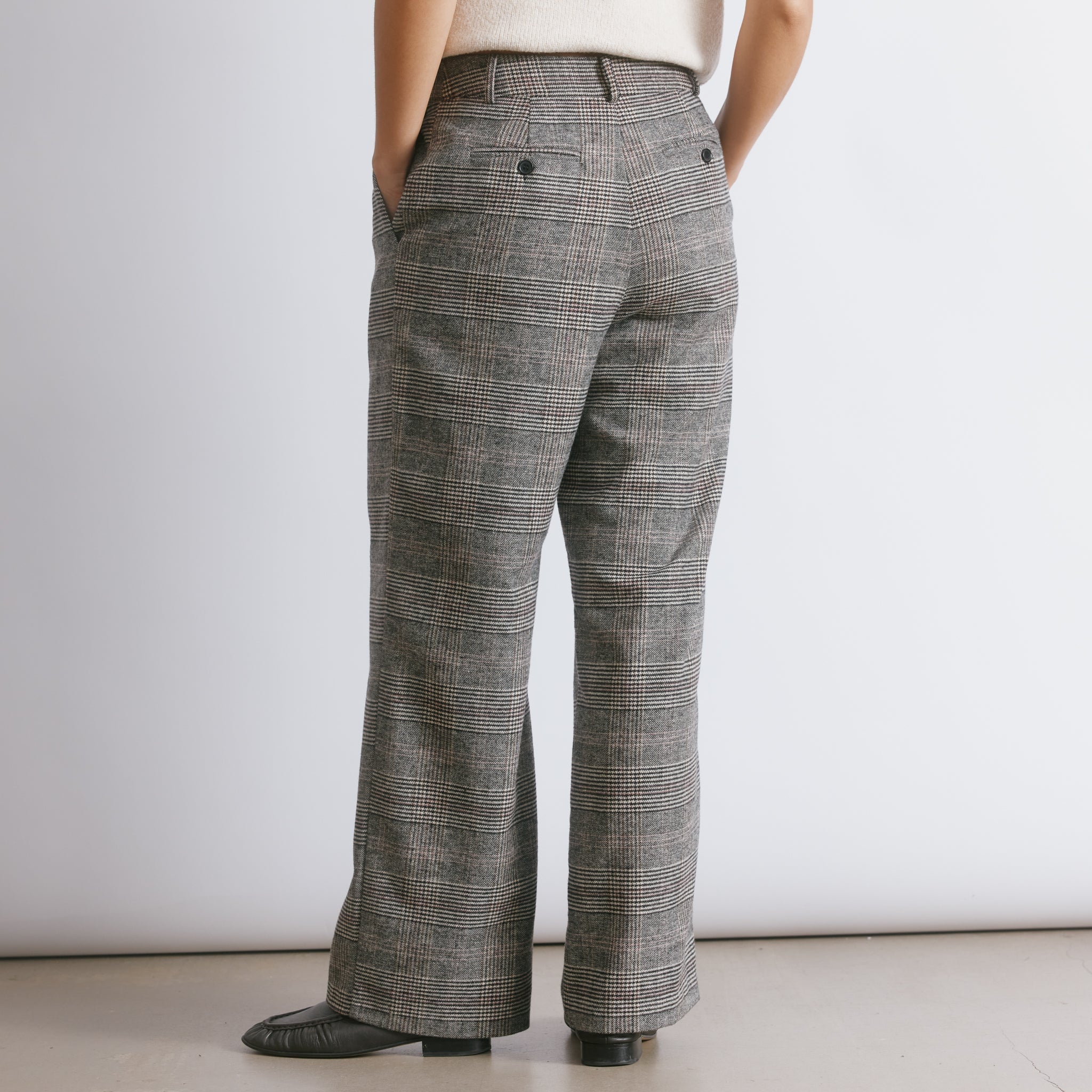 Tailored check trousers in a straight leg cut with pleated front detailing and a classic check pattern.  