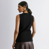 Black sleeveless cardigan with longline knit design, featuring a cutaway hem and versatile layering waistcoat style in ecovero viscose, sustainable knitwear essential.